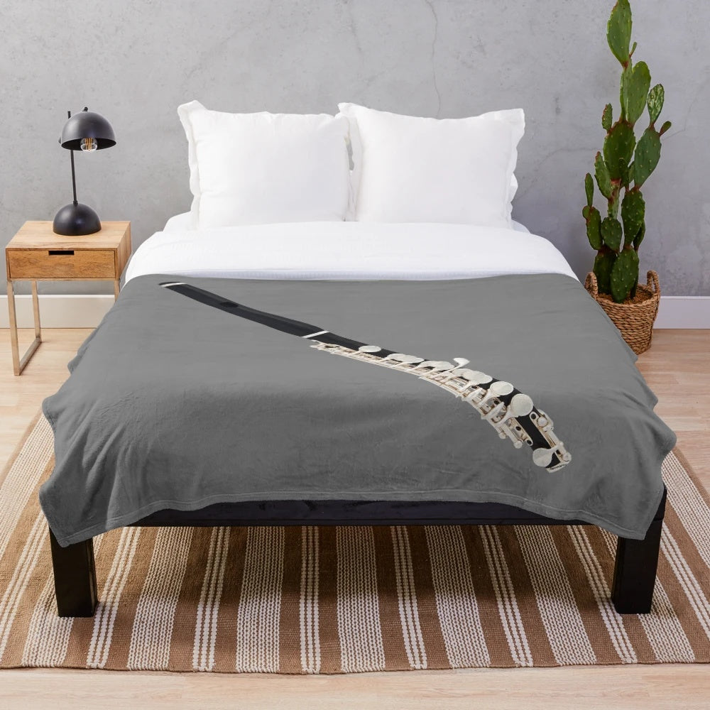 Plush blanket with piccolo and music notes design