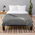 Plush blanket with piccolo and music notes design