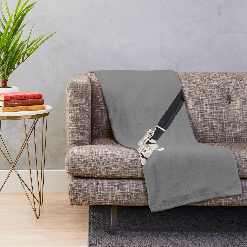 Plush blanket with piccolo and music notes design