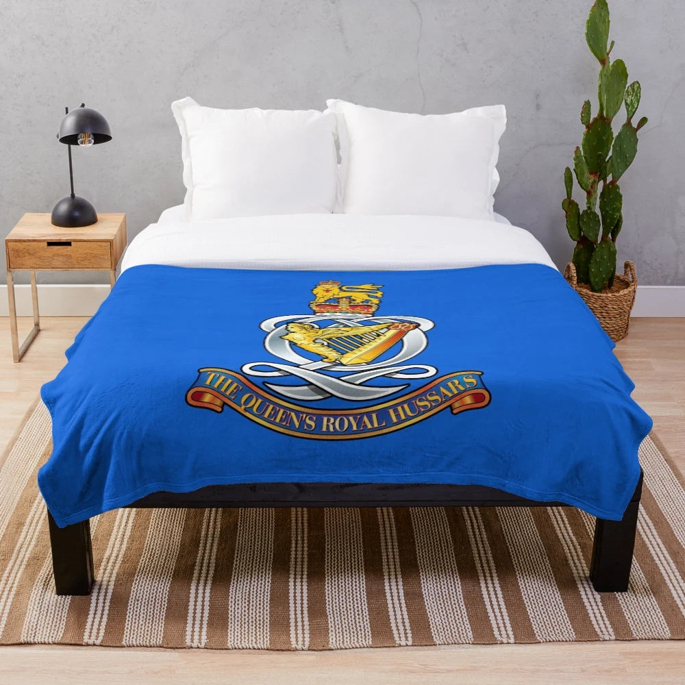 Plush blanket featuring the insignia of The Queen's Royal Hussars