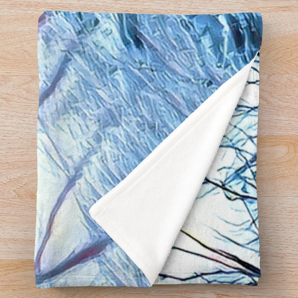 Plush blanket with snowy mountain landscape design