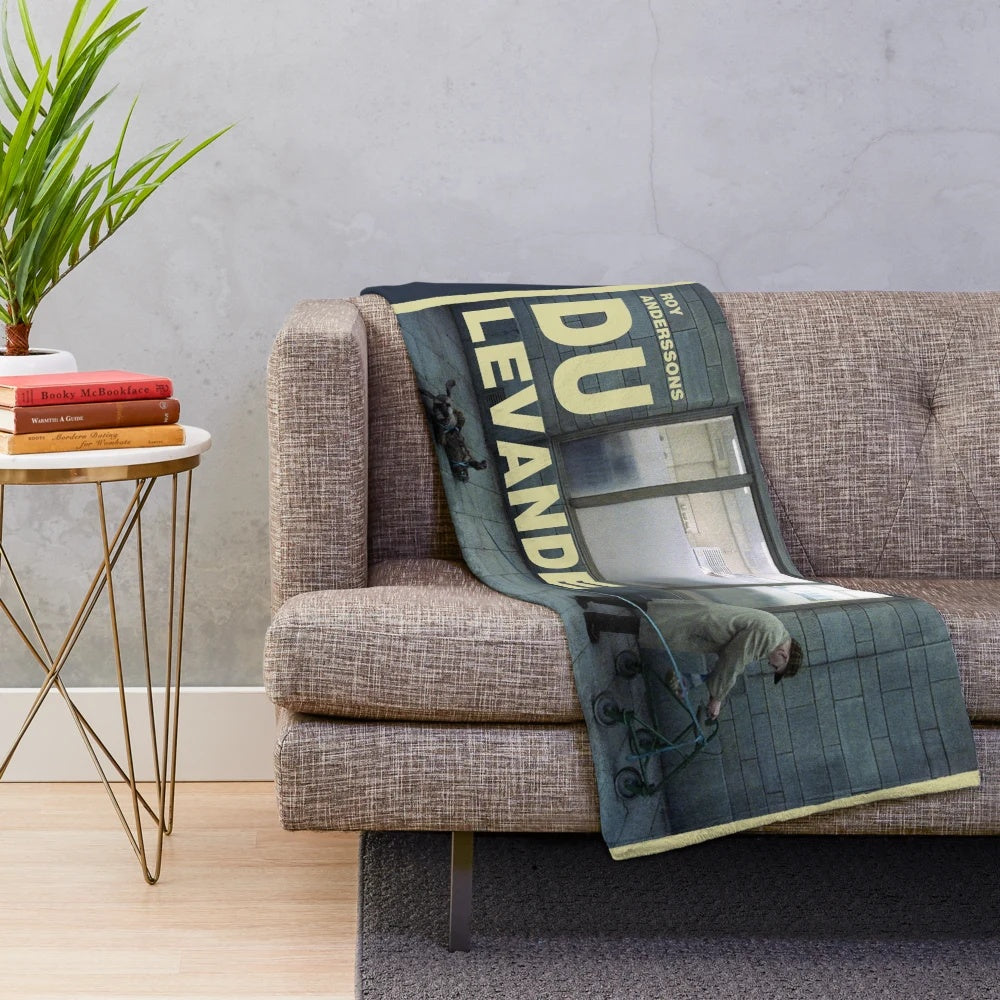 Plush blanket featuring a scene from the cult classic Swedish film "Du levande