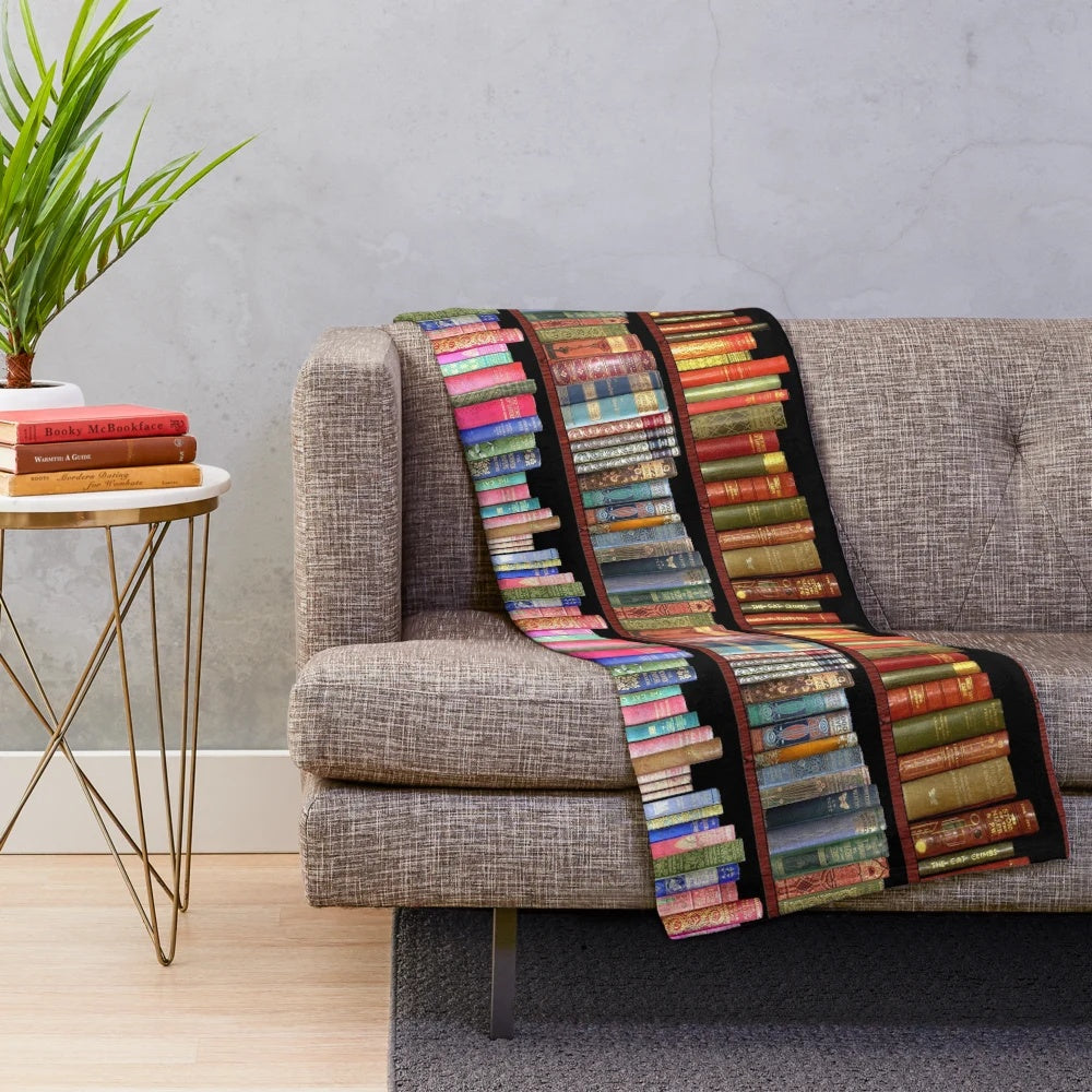 Plush blanket featuring vintage book covers and classic literature designs