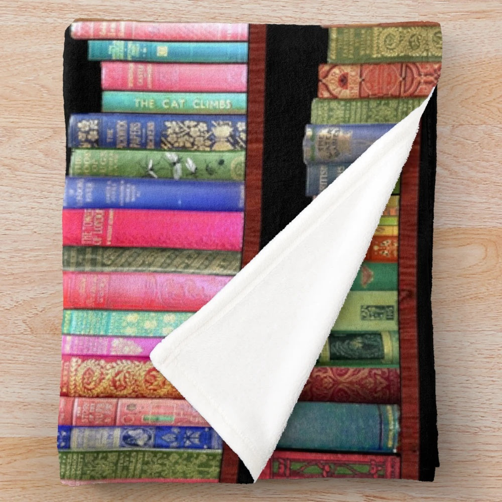 Plush blanket featuring vintage book covers and classic literature designs