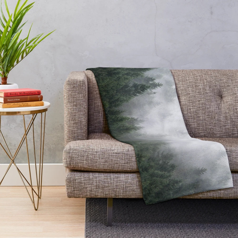 Plush blanket with a misty, fairytale-like forest design