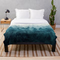 Plush blanket featuring a dreamy, foggy forest landscape
