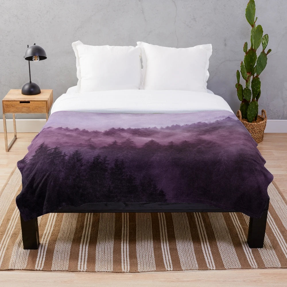 Plush blanket with a dreamy, moody forest landscape design