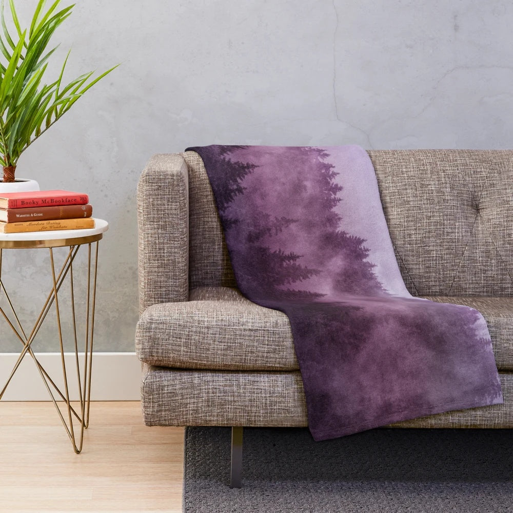 Plush blanket with a dreamy, moody forest landscape design