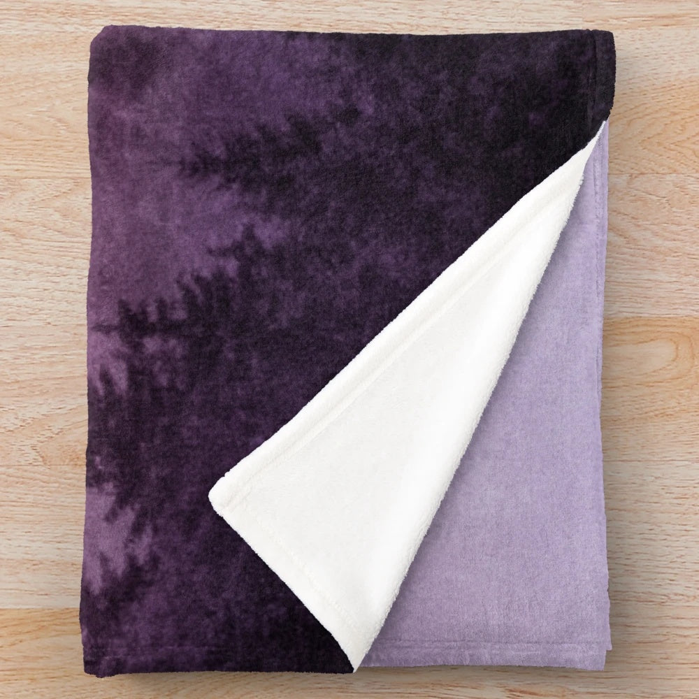 Plush blanket with a dreamy, moody forest landscape design