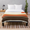 Cozy plush blanket featuring a sunset ocean surfing scene in retro 1970s style