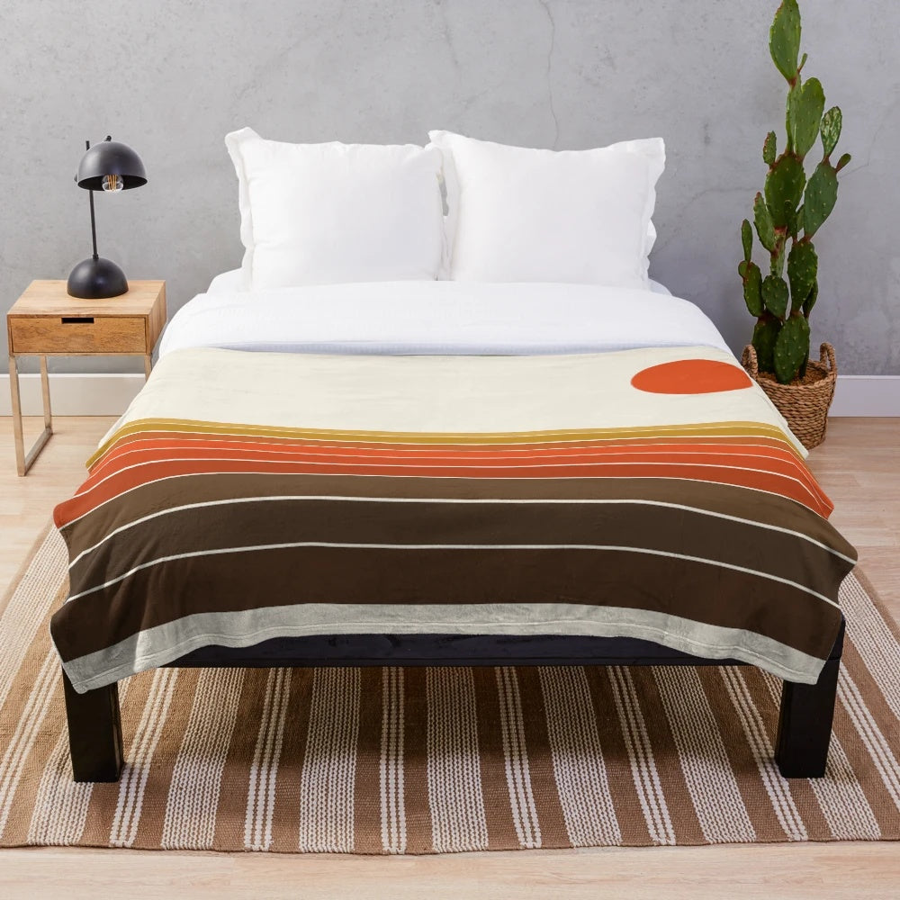 Cozy plush blanket featuring a sunset ocean surfing scene in retro 1970s style