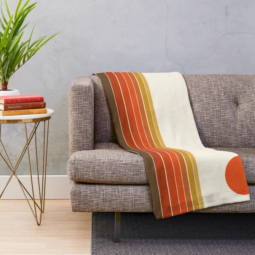 Cozy plush blanket featuring a sunset ocean surfing scene in retro 1970s style