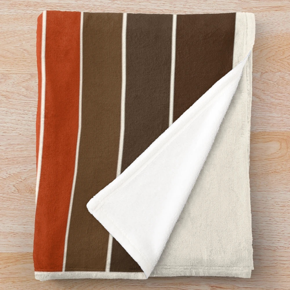 Cozy plush blanket featuring a sunset ocean surfing scene in retro 1970s style