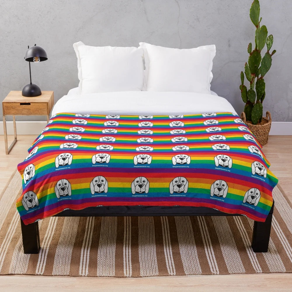 Soft and plush blanket in pride colors supporting animal rescue and LGBTQ+ causes