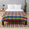 Soft and plush blanket in pride colors supporting animal rescue and LGBTQ+ causes