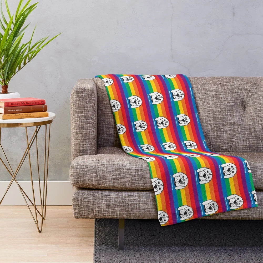 Soft and plush blanket in pride colors supporting animal rescue and LGBTQ+ causes
