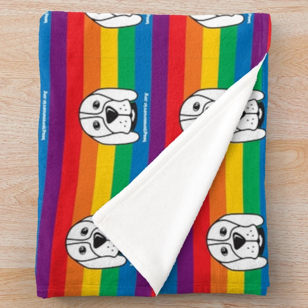 Soft and plush blanket in pride colors supporting animal rescue and LGBTQ+ causes