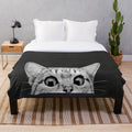 Plush blanket with black and white animal print design