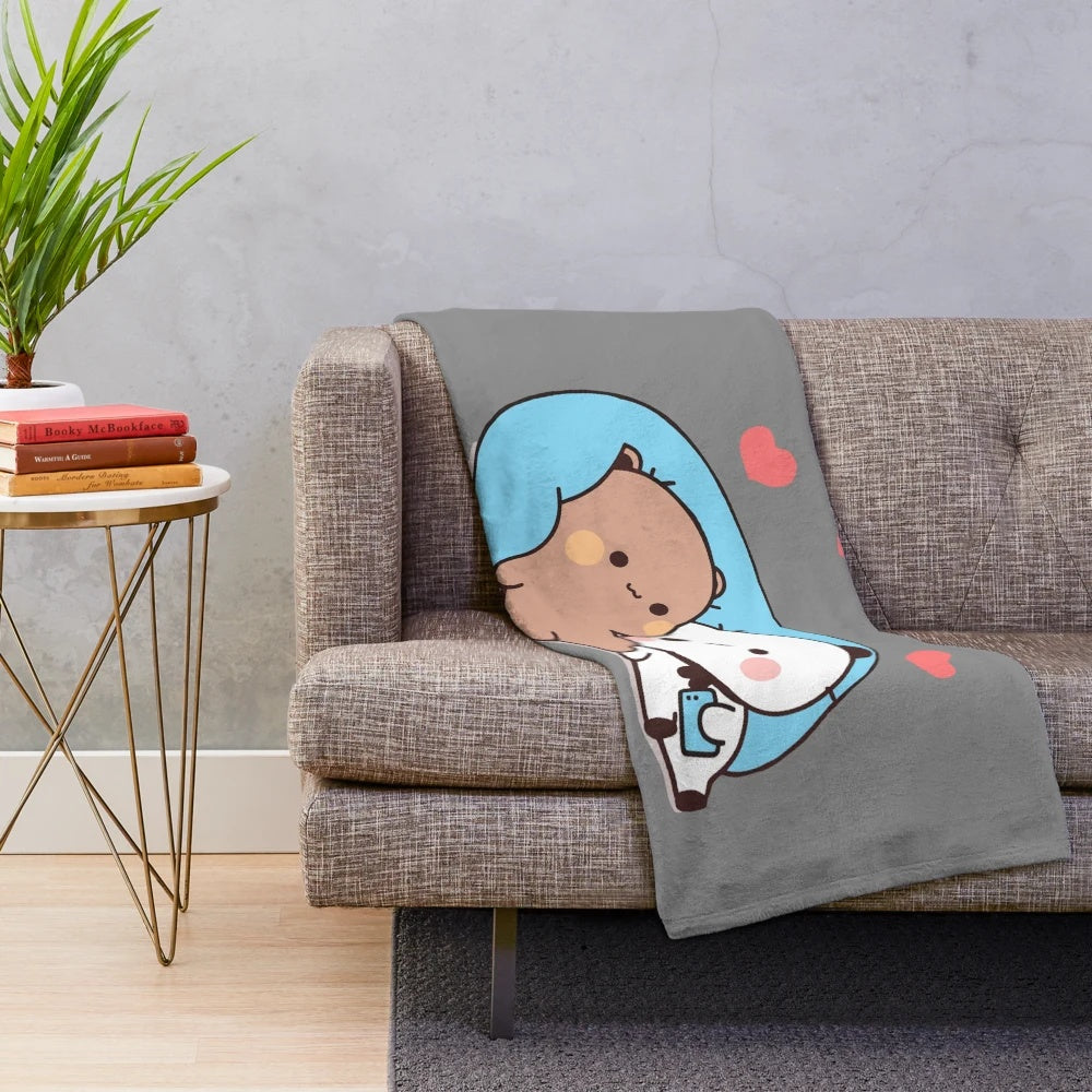 Plush blanket featuring DuDu bear and BuBu panda in a loving embrace