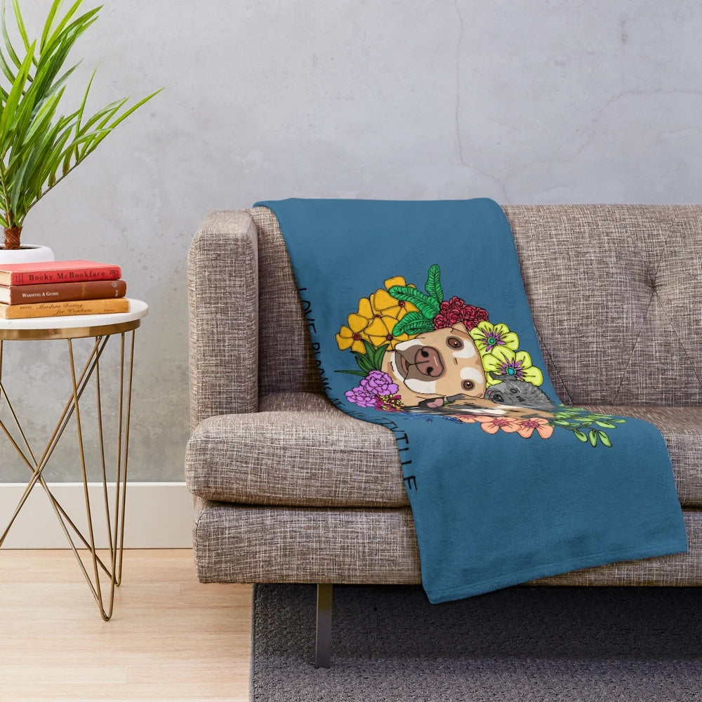 Plush blanket featuring cute dogs and blooming flowers