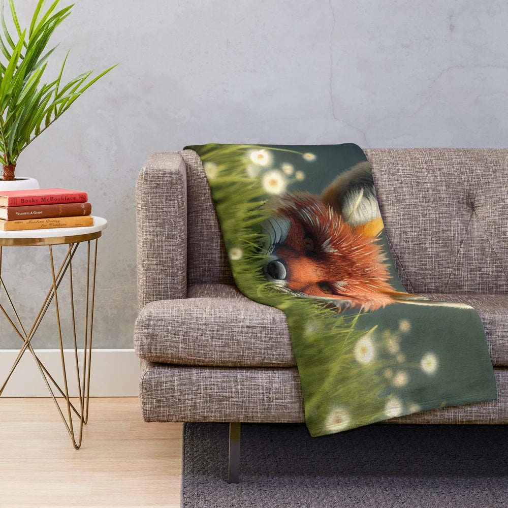 A cozy and soft plush blanket featuring an illustration of a fox in a colorful grassy field