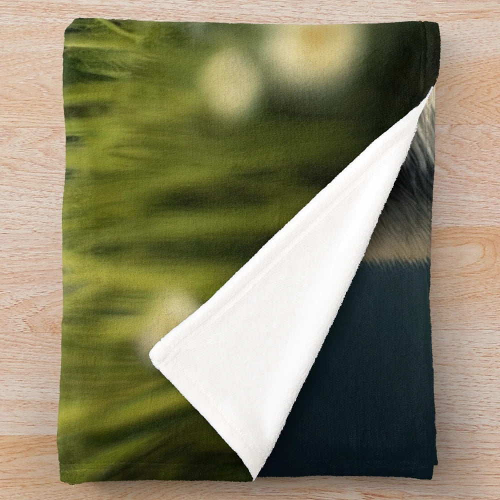 A cozy and soft plush blanket featuring an illustration of a fox in a colorful grassy field