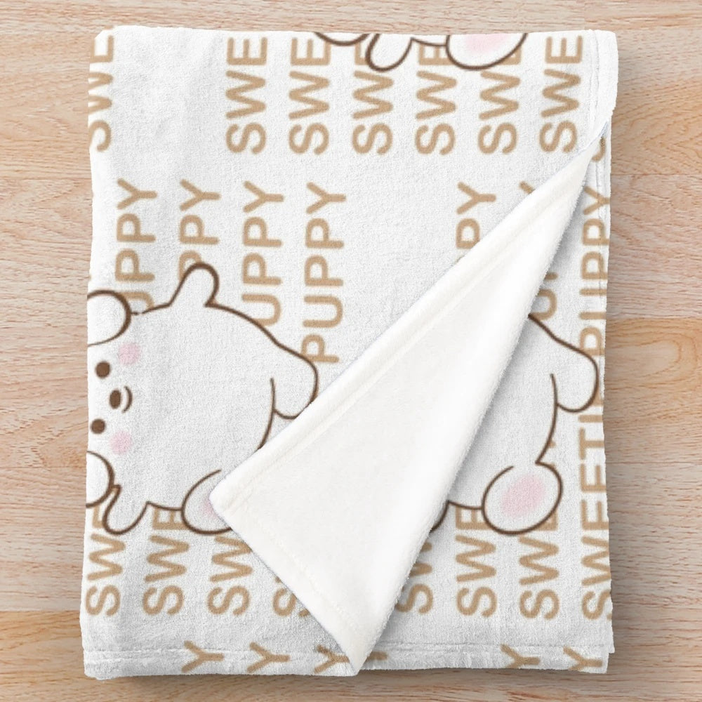 Soft and cuddly plush blanket featuring a cute puppy character