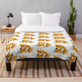 Cute sleeping corgi puppy couple on a plush blanket