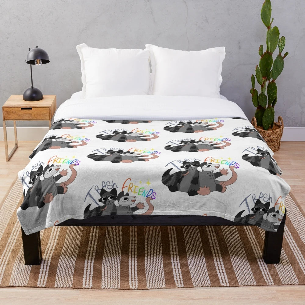 Soft plush blanket featuring opossum and raccoon designs