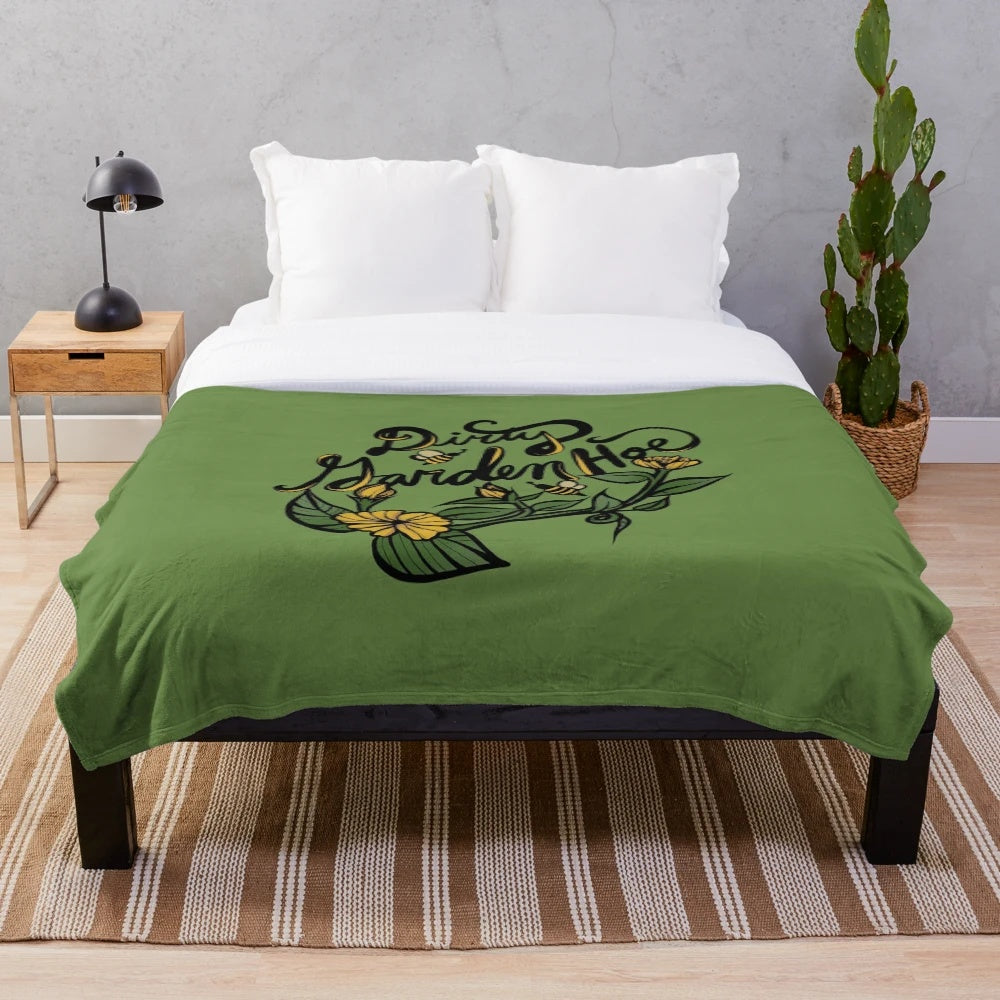 Plush blanket with a colorful and humorous "Dirty Garden Hoe" design