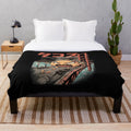 A cozy black and white plush blanket with an anime-inspired kaiju monster design