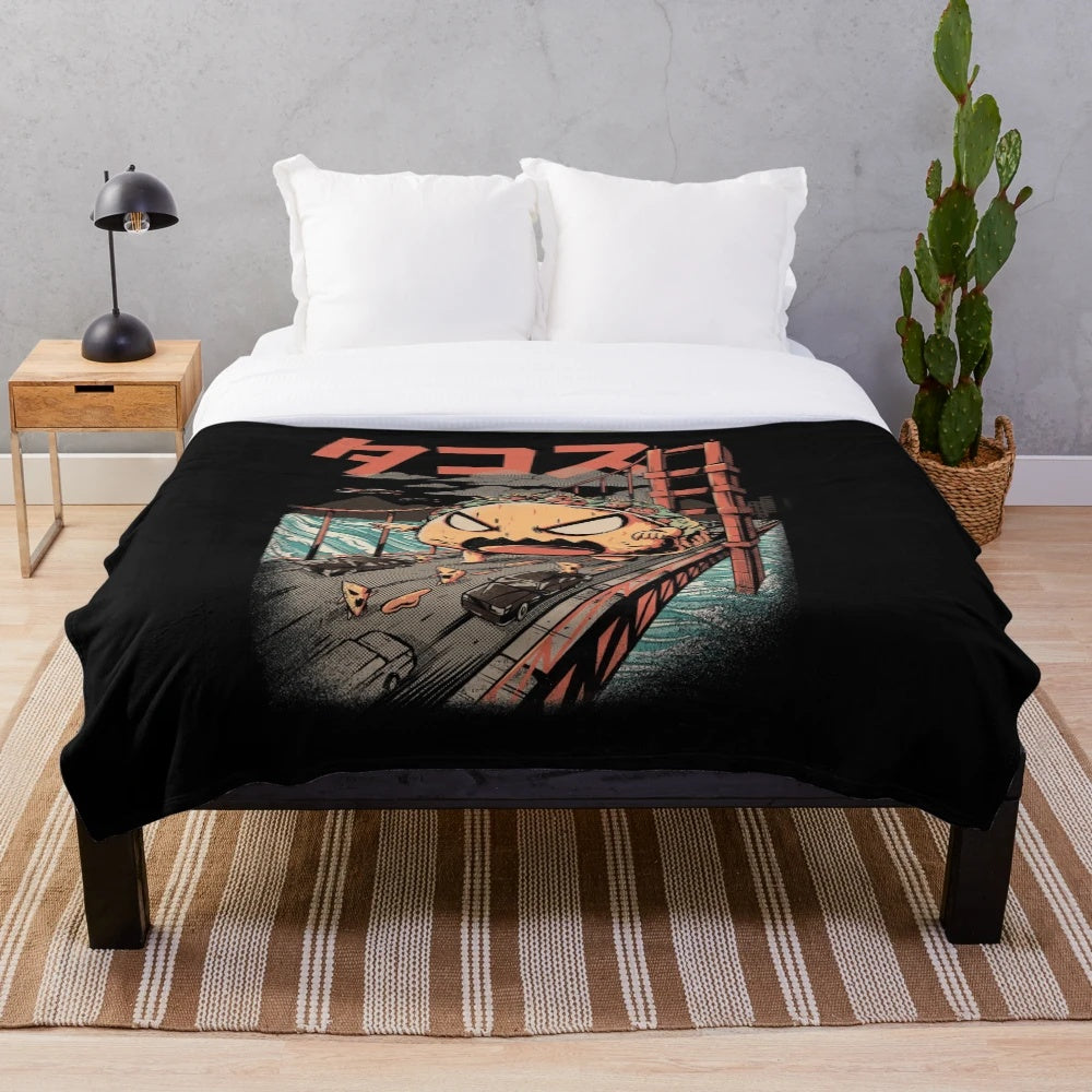 A cozy black and white plush blanket with an anime-inspired kaiju monster design