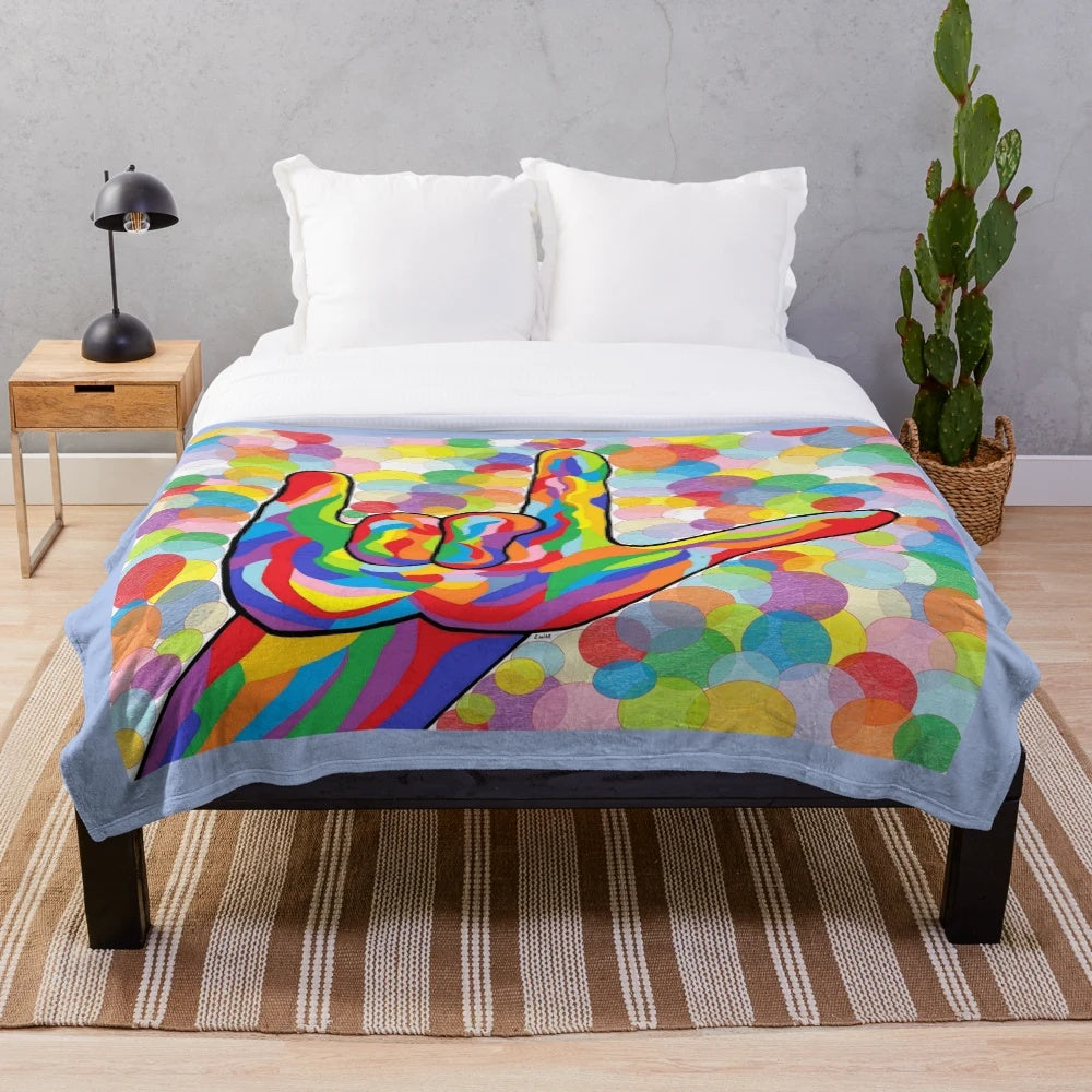 Plush blanket with American Sign Language "I Love You" on a bubble background