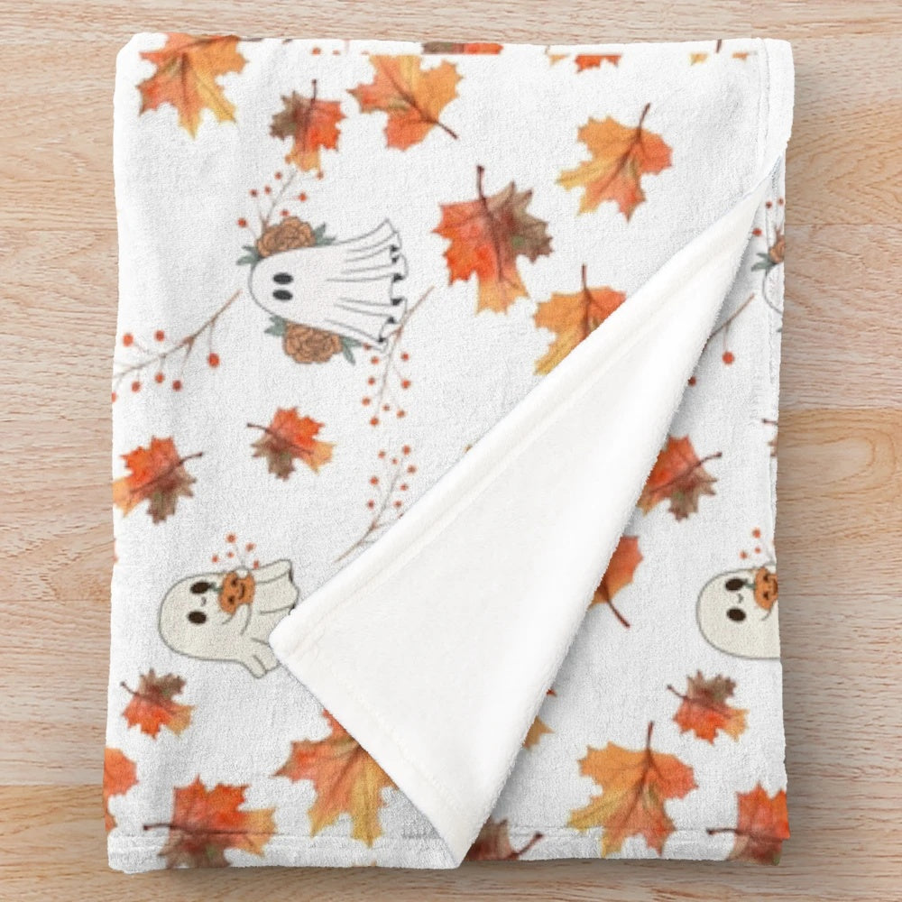 Cozy plush blanket featuring autumn-themed ghost designs