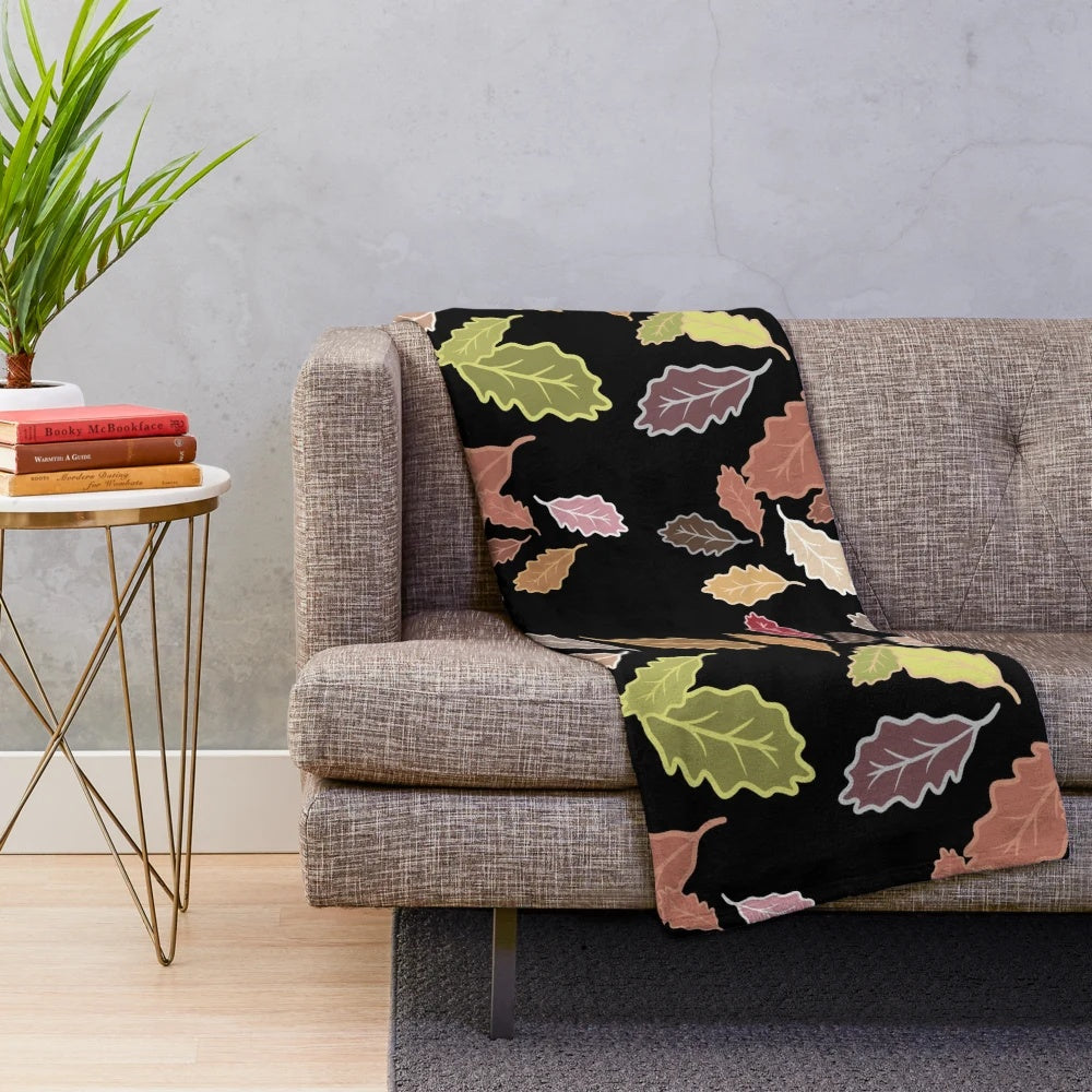 Plush blanket with abstract fall leaves and dull color palette