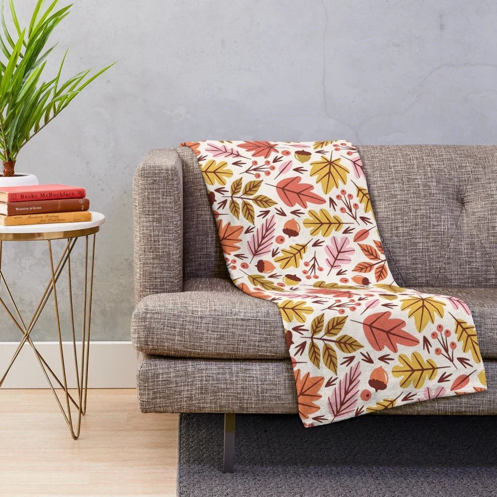 Cozy plush blanket with autumn leaves and acorn pattern