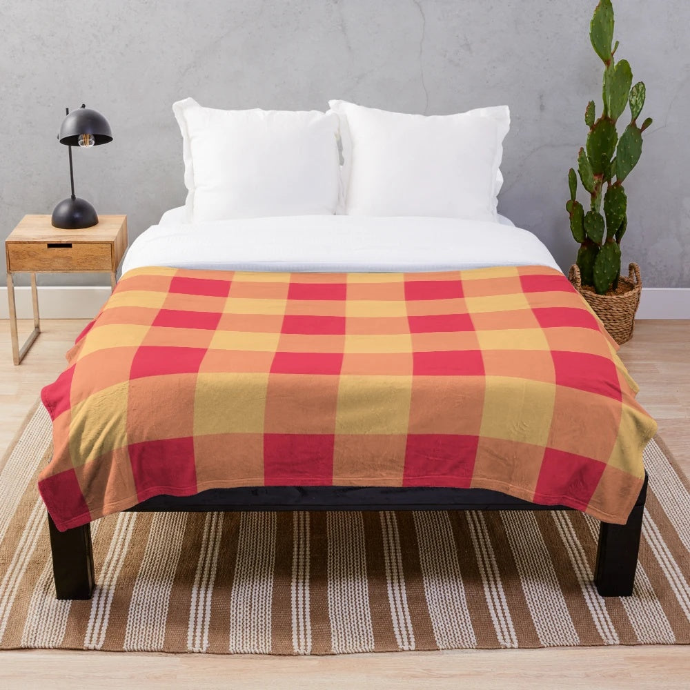 Soft, plush blanket with yellow and red plaid pattern, featuring an orchard watercolor design