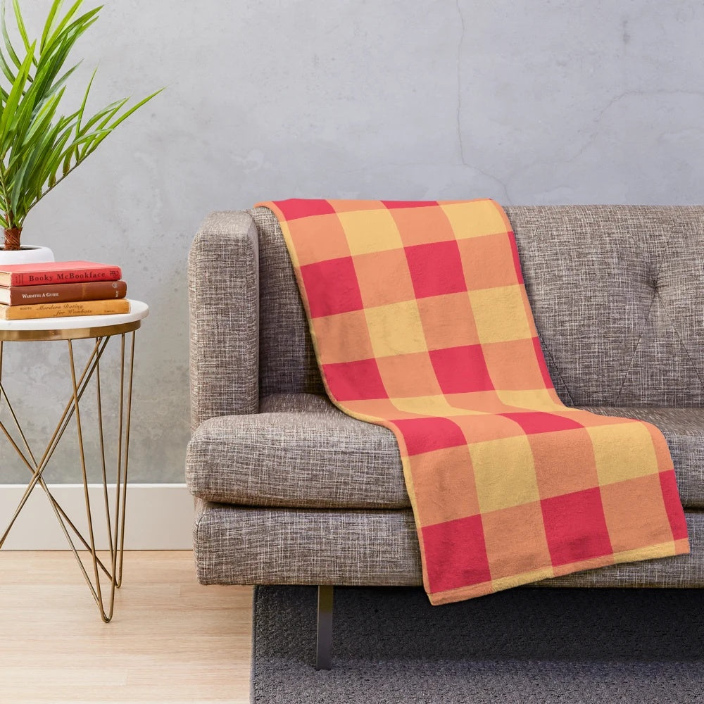 Soft, plush blanket with yellow and red plaid pattern, featuring an orchard watercolor design