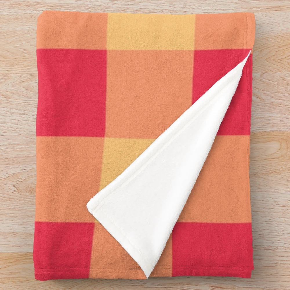 Soft, plush blanket with yellow and red plaid pattern, featuring an orchard watercolor design