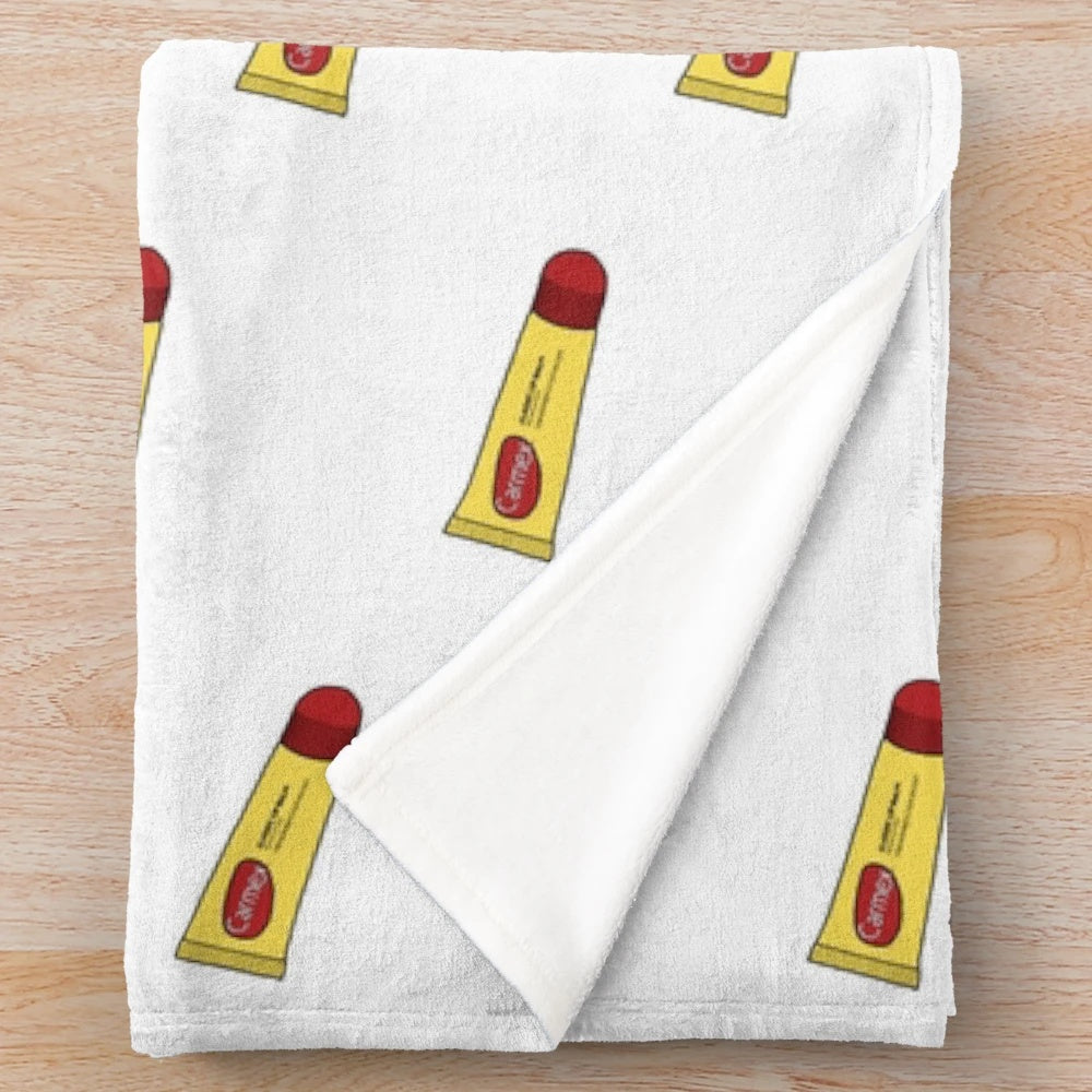 Cozy plush blanket with Carmex lip balm design
