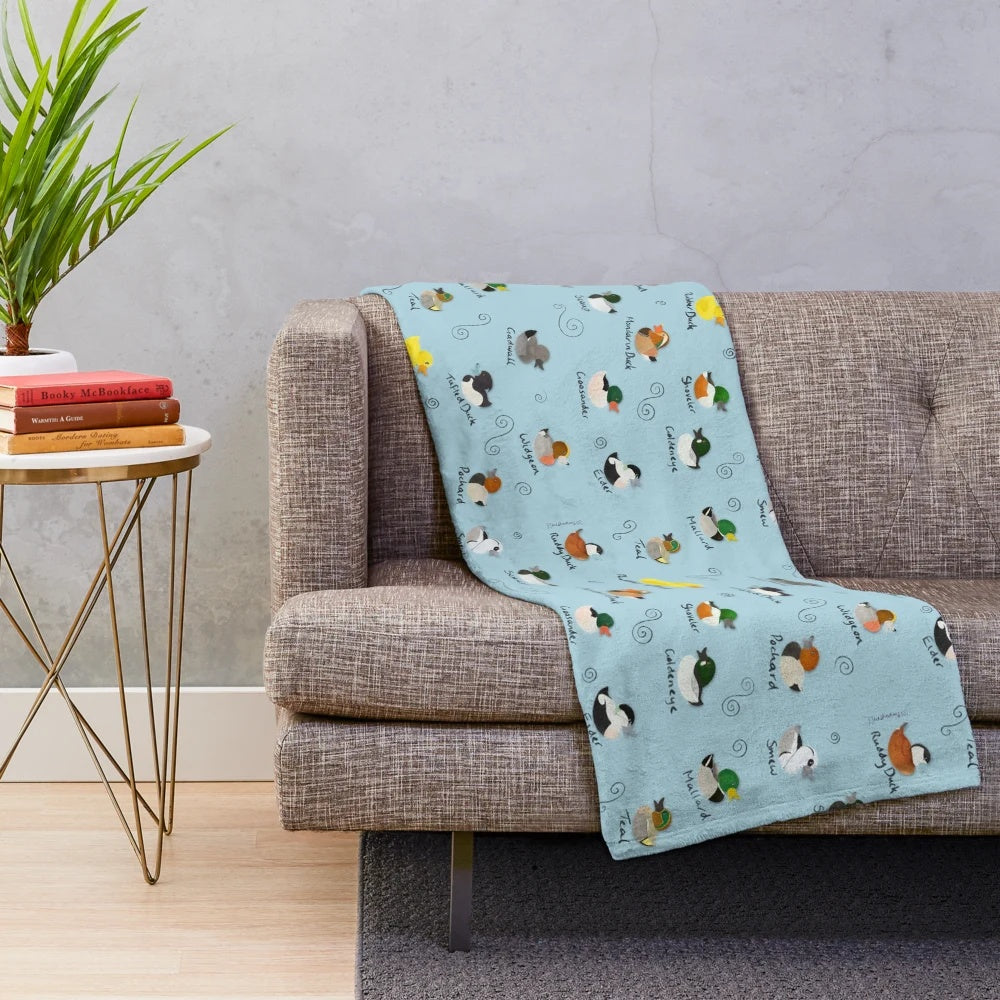 Plush blanket featuring a colorful pattern of British ducks