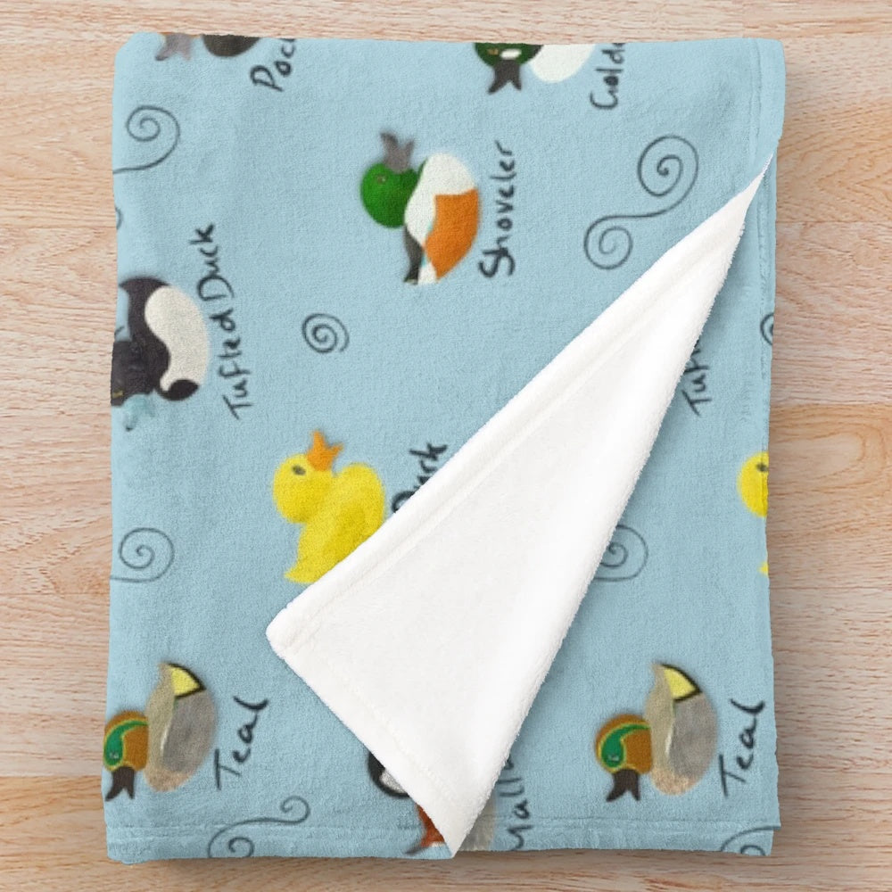 Plush blanket featuring a colorful pattern of British ducks