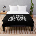 Soft, white plush blanket with "No place like home" quote