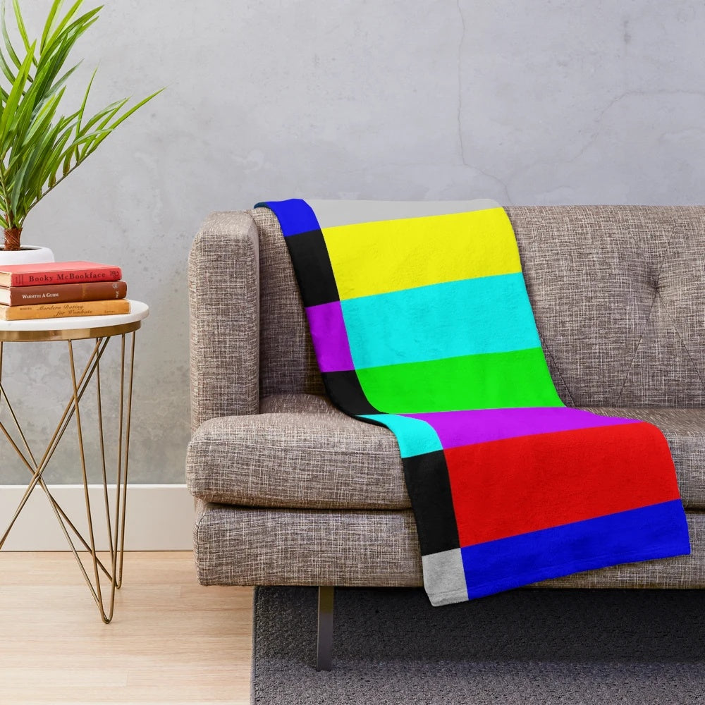 Plush blanket with vibrant TV color bars on white background