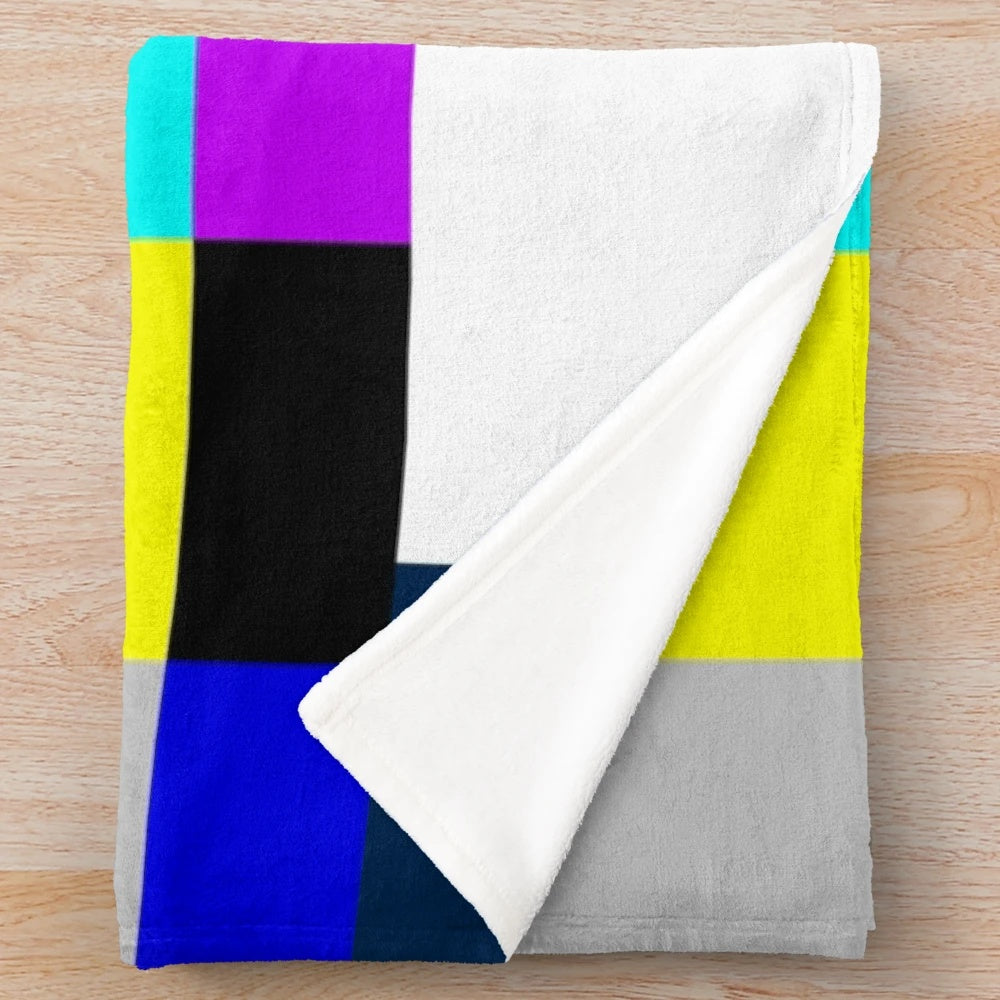 Plush blanket with vibrant TV color bars on white background