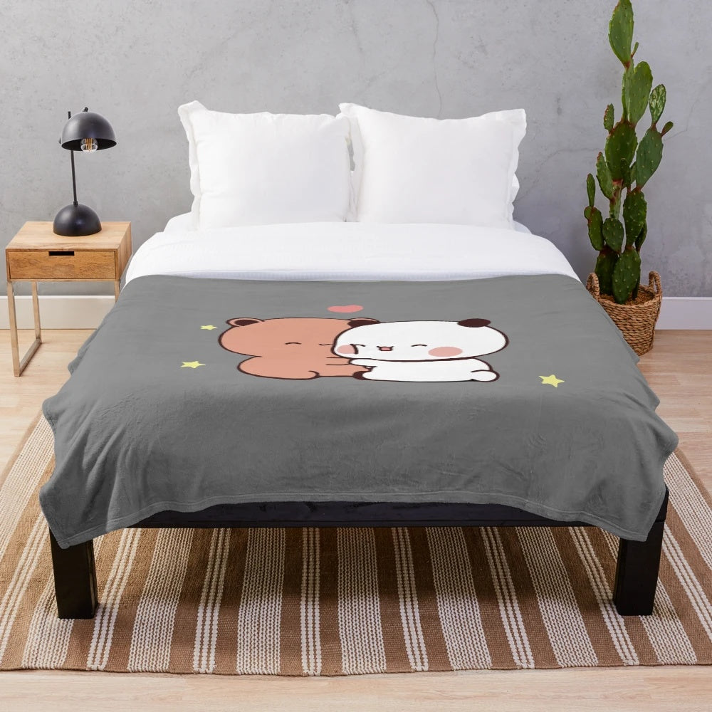 Plush blanket featuring a cute cartoon couple of a bear and panda bear hugging