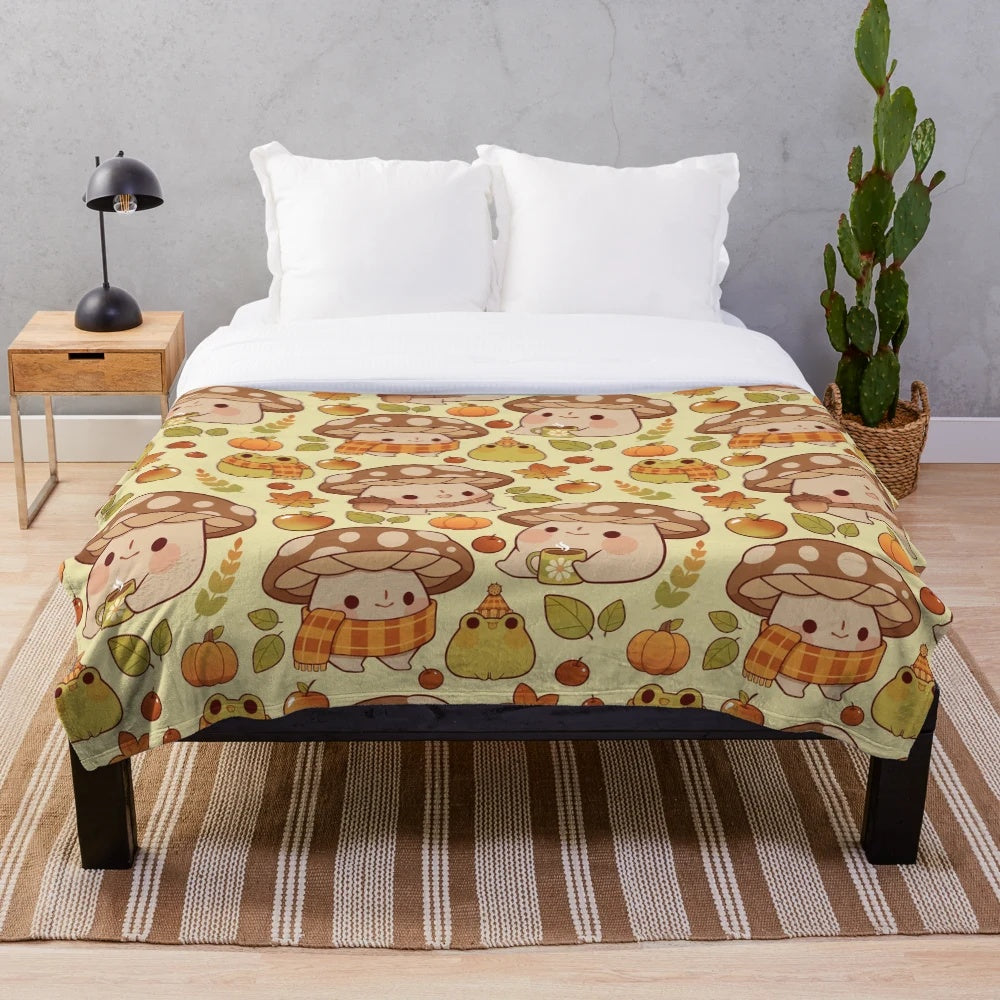 Plush blanket with whimsical mushroom and frog pattern in fall colors