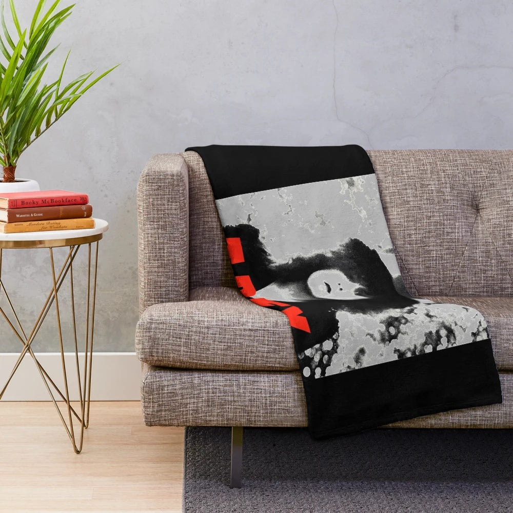 Cozy plush blanket featuring a dinosaur and 1970s music theme