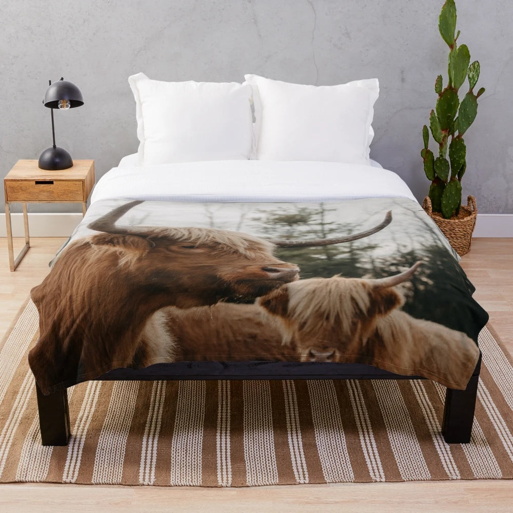 Plush blanket featuring a dramatic portrait of a highland cow in a scenic countryside landscape