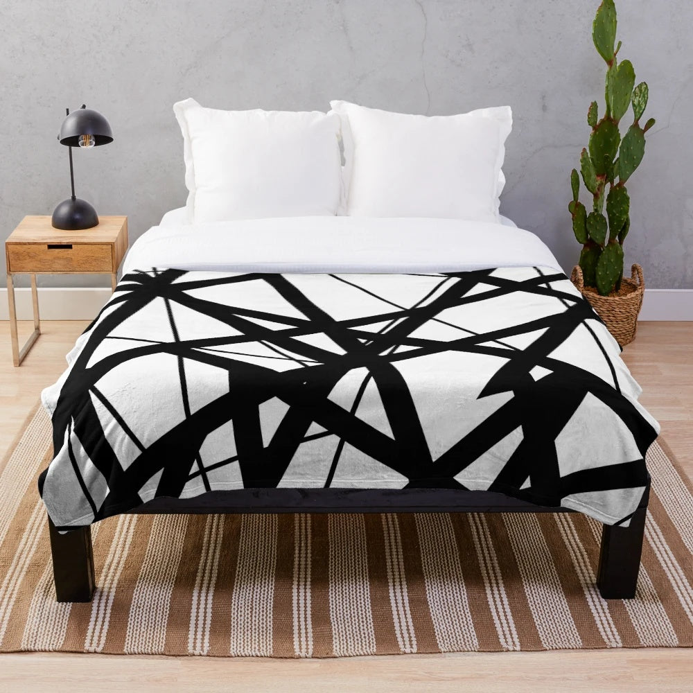 Plush blanket with black and white stripes inspired by Eddie Van Halen's iconic guitar design